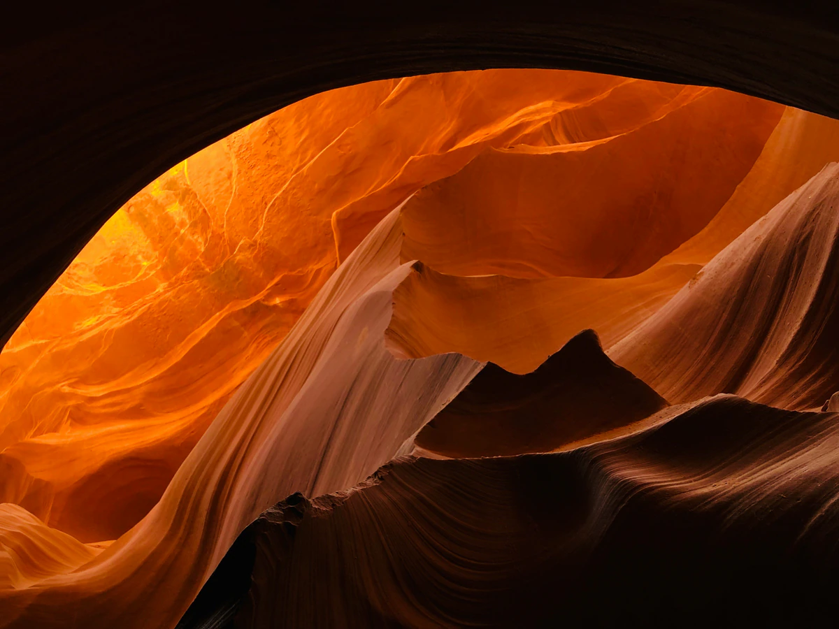 Bright orange sandstone arch inside Antelope Canyon