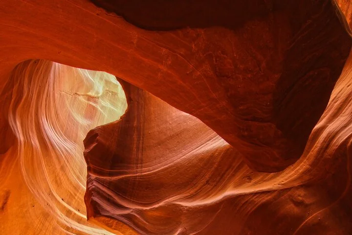 Curving orange sandstone walls inside Upper Antelope Canyon