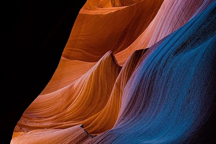Orange and blue light on sculpted Antelope Canyon walls