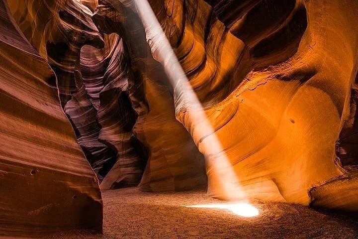 Light beam reaching the sandy floor of Upper Antelope Canyon